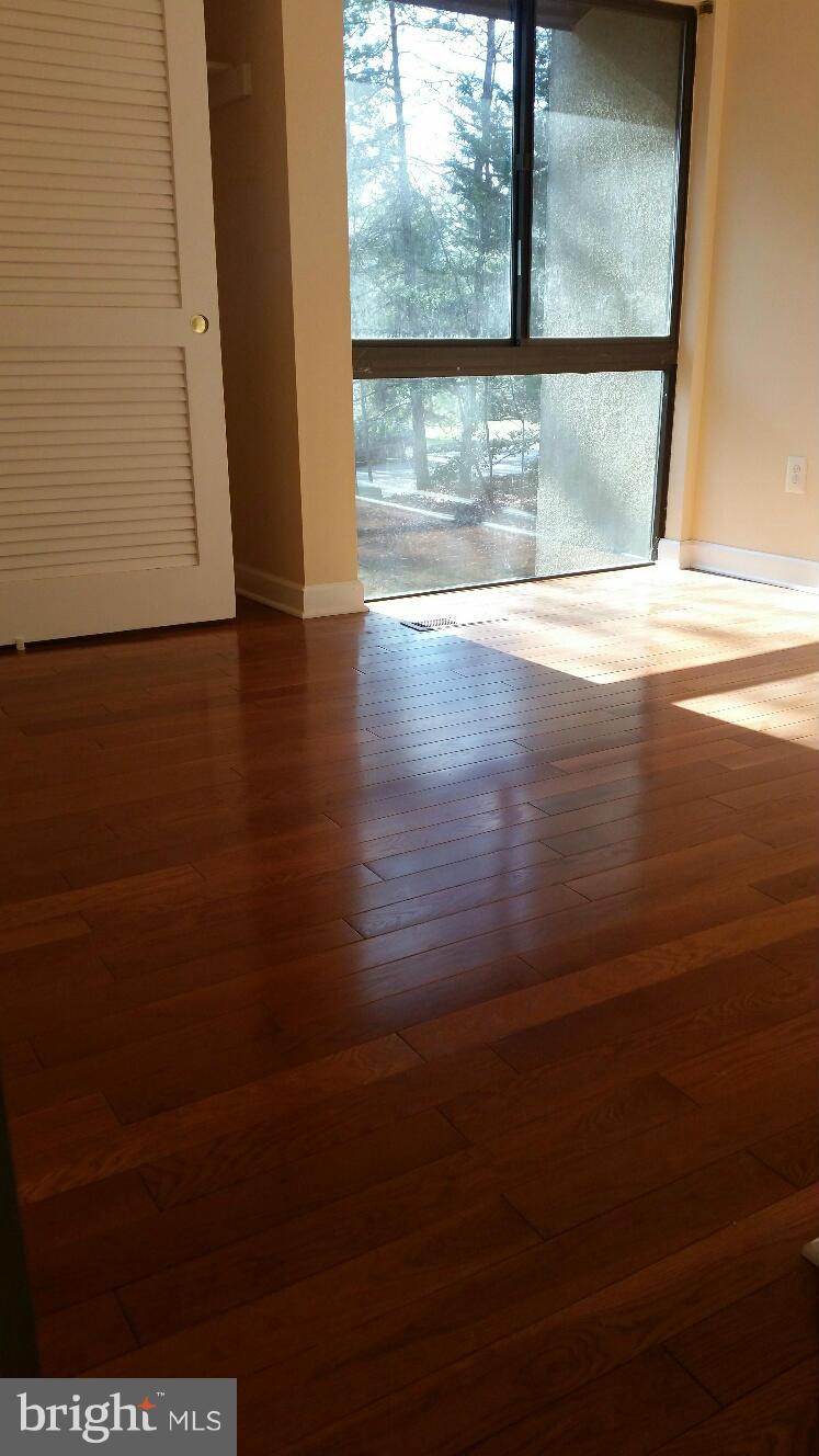 11655 Newbridge Court Reston, VA 20191 - Photo 22 of 30 a view of a room with wooden floor