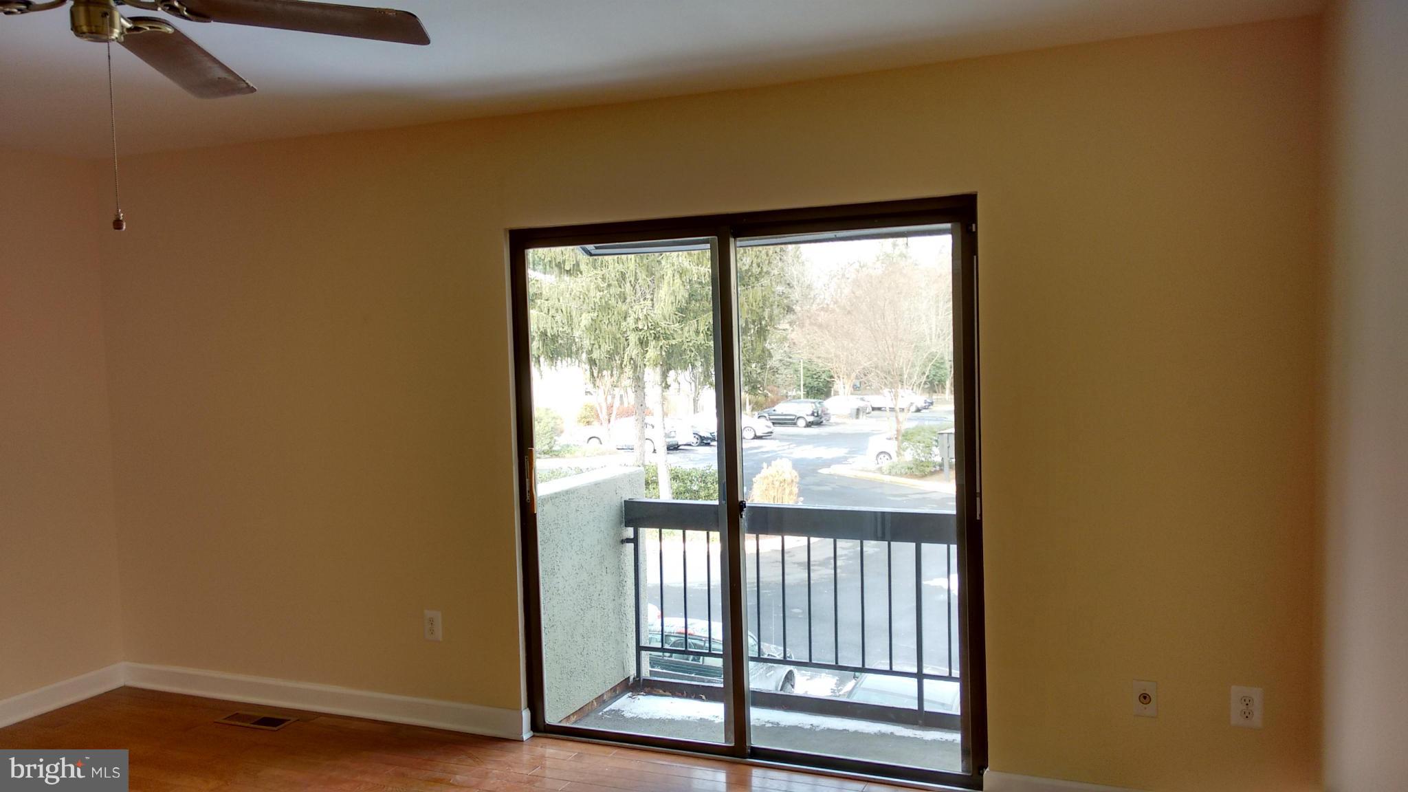 11655 Newbridge Court Reston, VA 20191 - Photo 26 of 30 a view of empty room with wooden floor