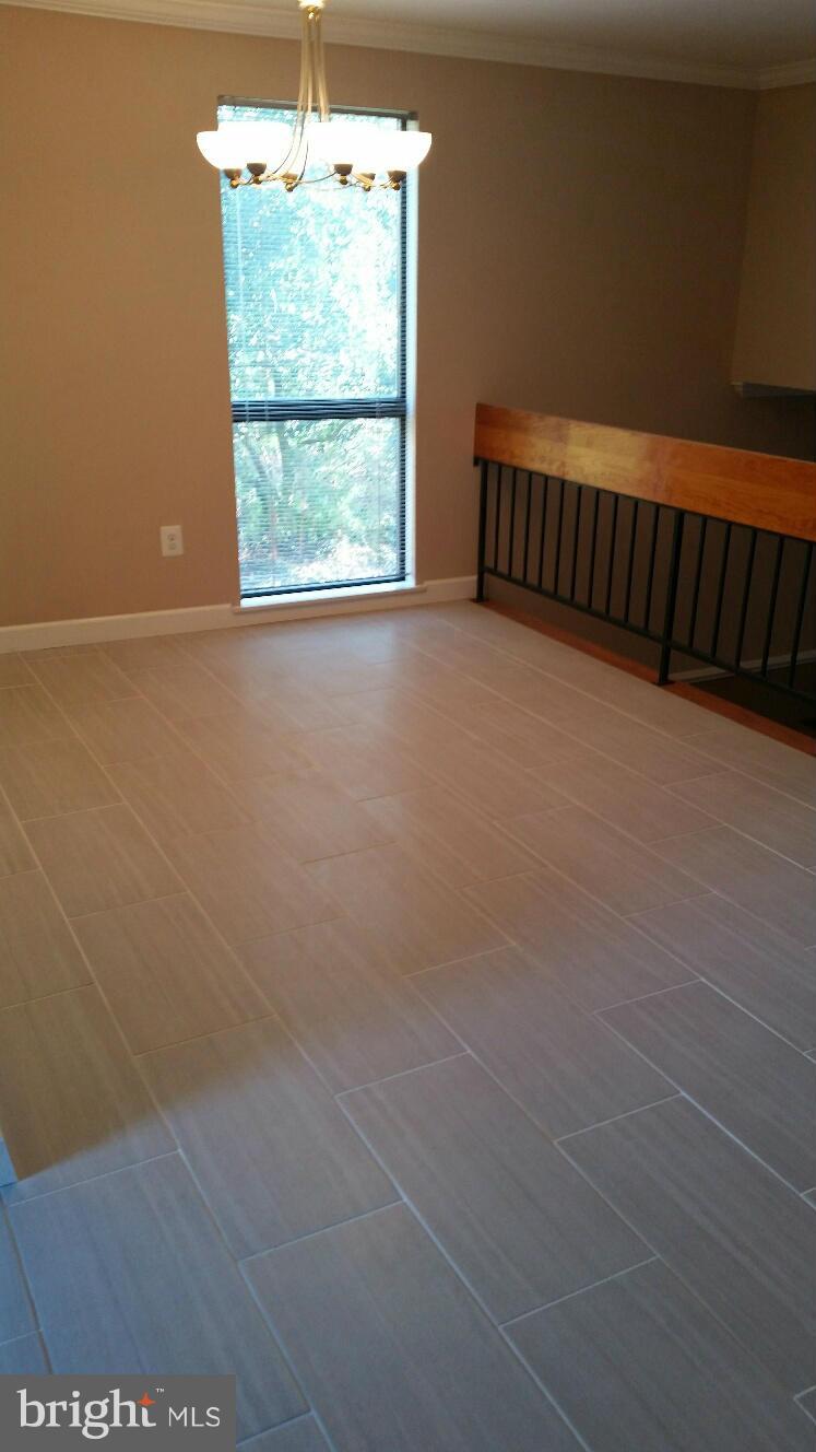 11655 Newbridge Court Reston, VA 20191 - Photo 8 of 30 a view of a livingroom with an empty space and a window