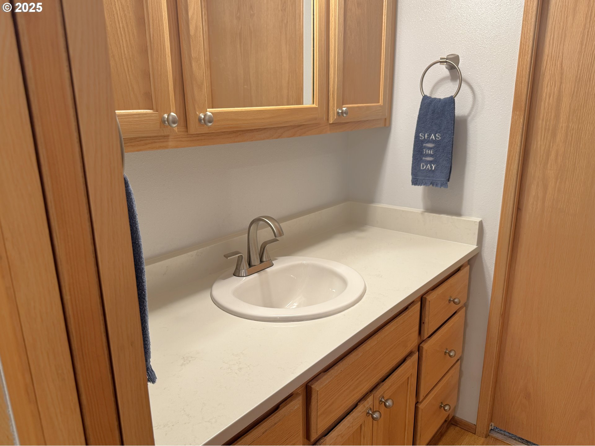 19921 Whaleshead Road, Unit EL1 Brookings, OR 97415 - Photo 15 of 29 a bathroom with a sink and a mirror