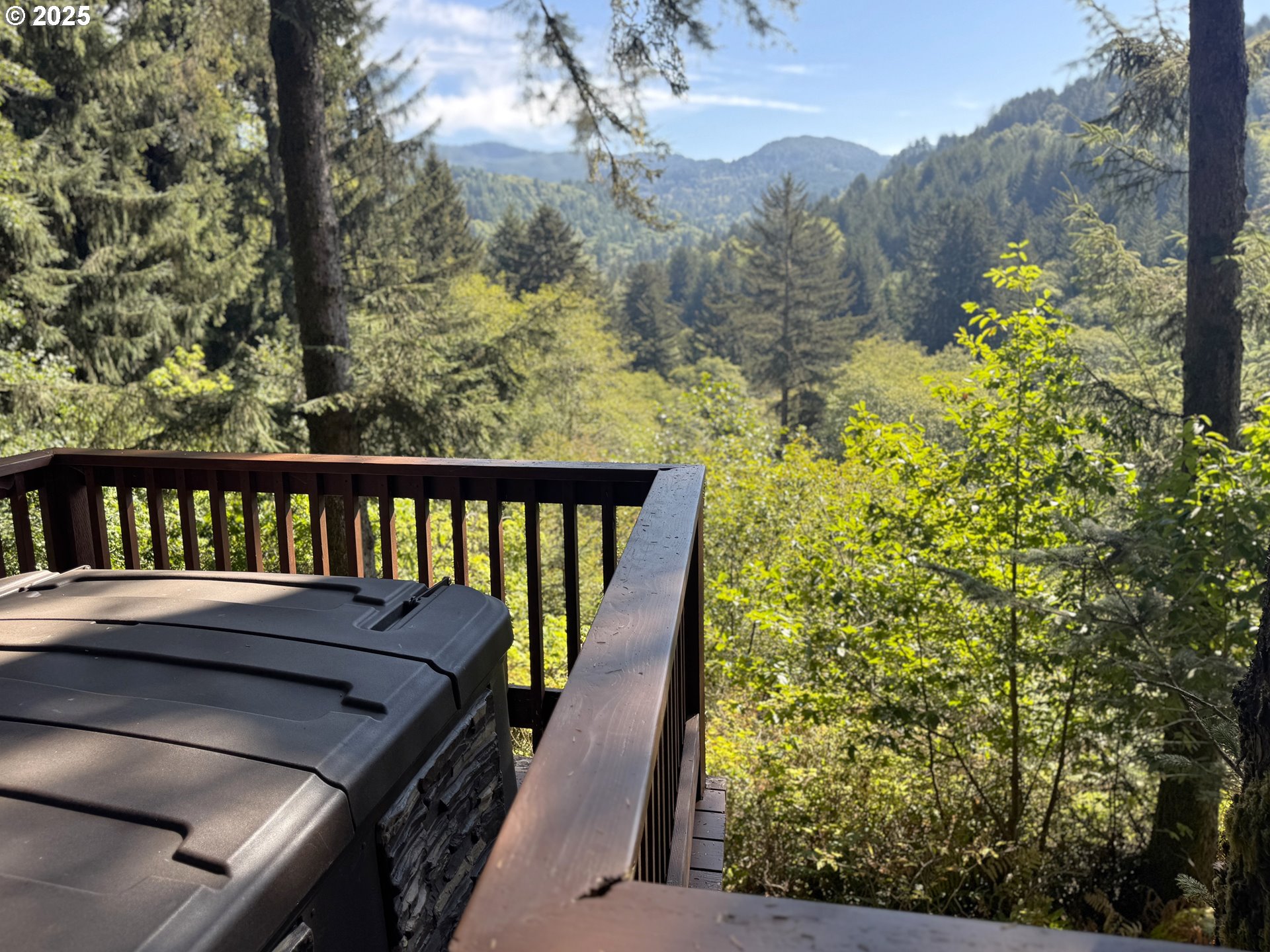 19921 Whaleshead Road, Unit EL1 Brookings, OR 97415 - Photo 18 of 29 a view of a balcony with table and chairs