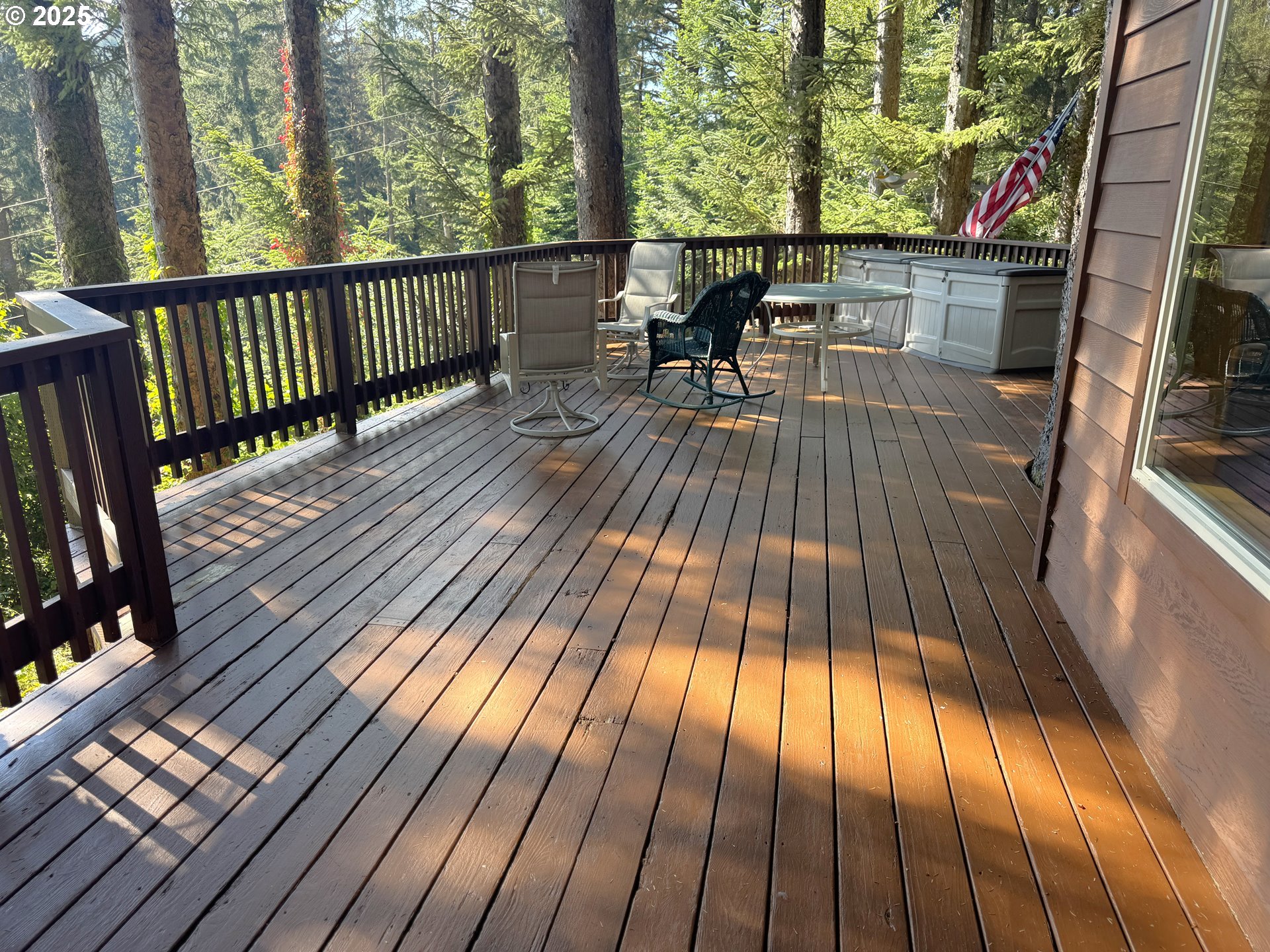 19921 Whaleshead Road, Unit EL1 Brookings, OR 97415 - Photo 20 of 29 a view of balcony with wooden floor and outdoor seating