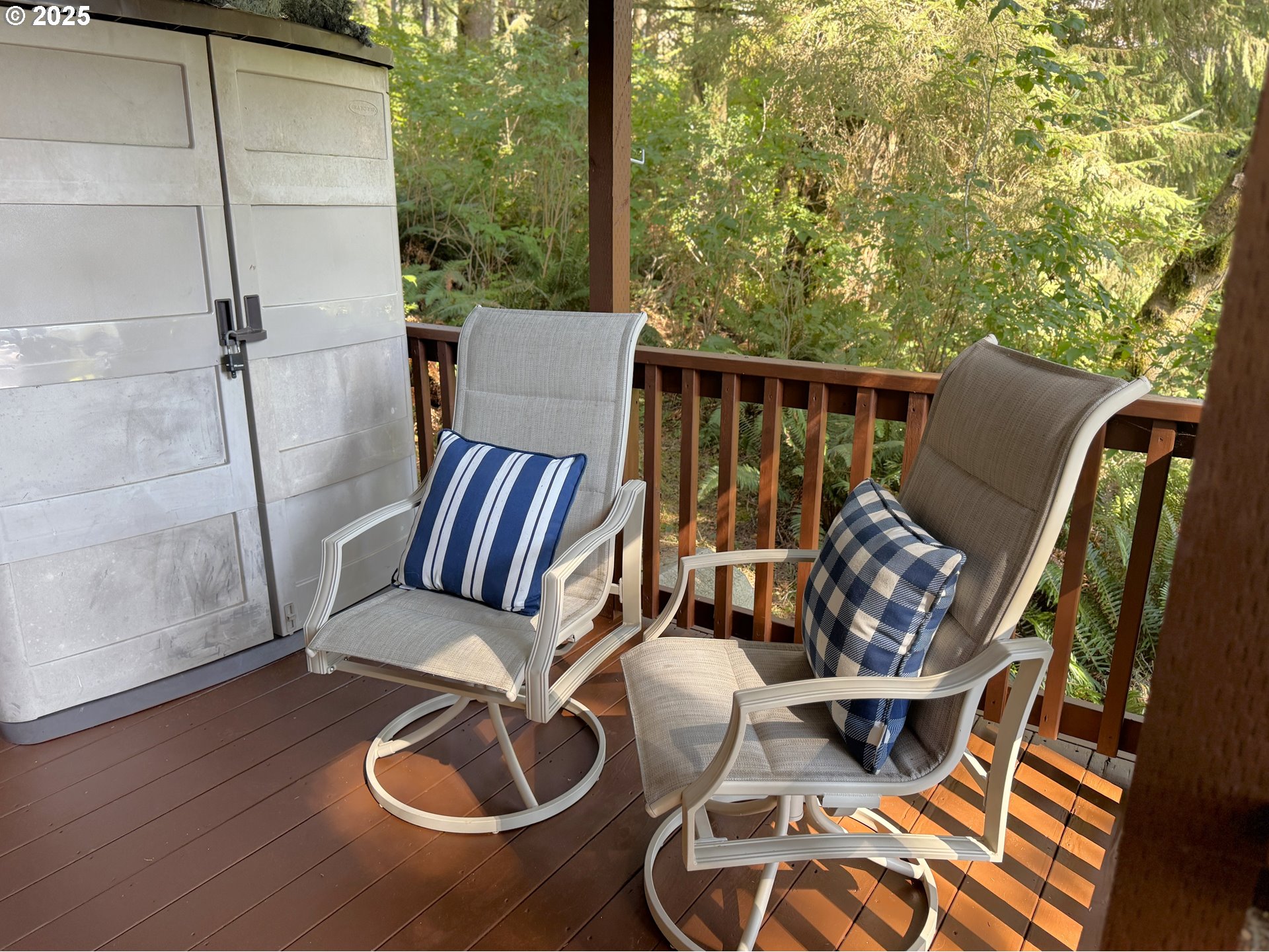 19921 Whaleshead Road, Unit EL1 Brookings, OR 97415 - Photo 24 of 29 a balcony with furniture and wooden floor