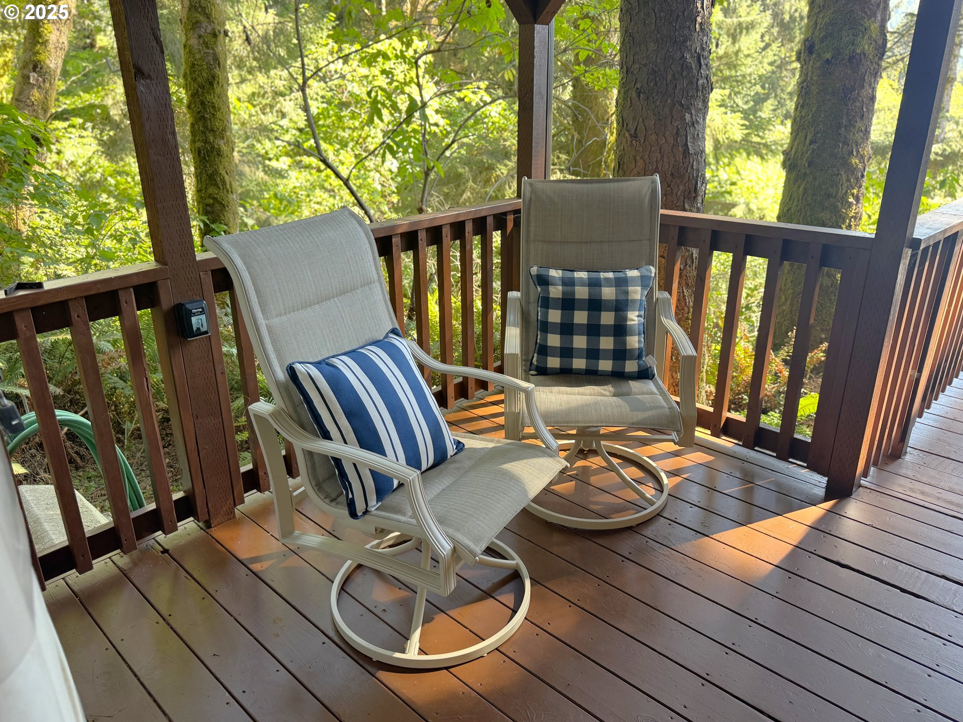 19921 Whaleshead Road, Unit EL1 Brookings, OR 97415 - Photo 25 of 29 a view of deck with chairs and wooden floor