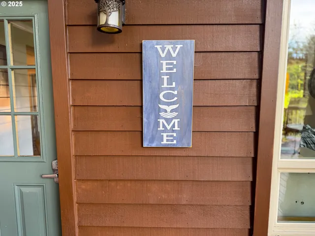 a view of a door and wooden floor
