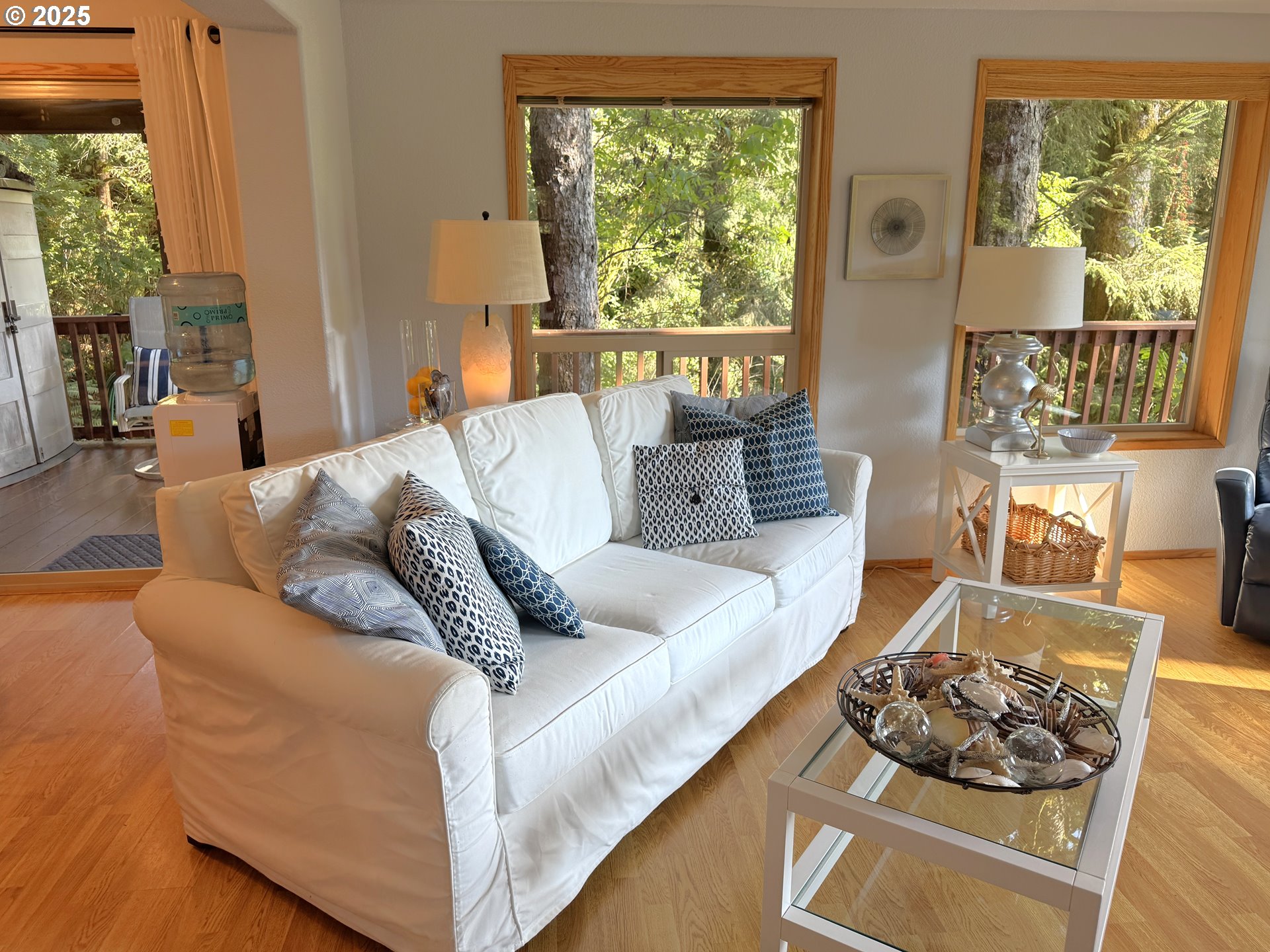 19921 Whaleshead Road, Unit EL1 Brookings, OR 97415 - Photo 5 of 29 a living room with furniture and a large window