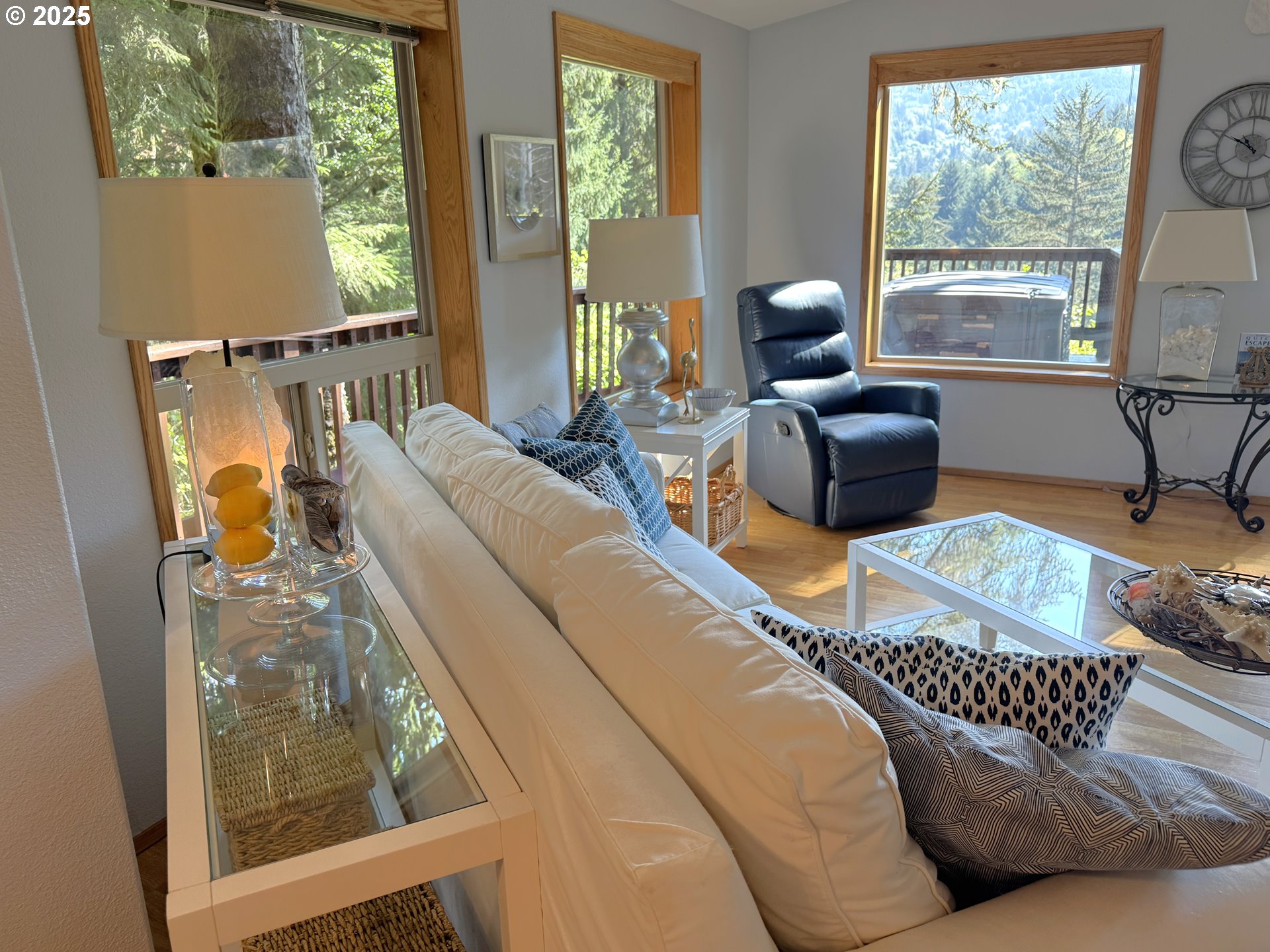 19921 Whaleshead Road, Unit EL1 Brookings, OR 97415 - Photo 7 of 29 a living room with furniture and windows