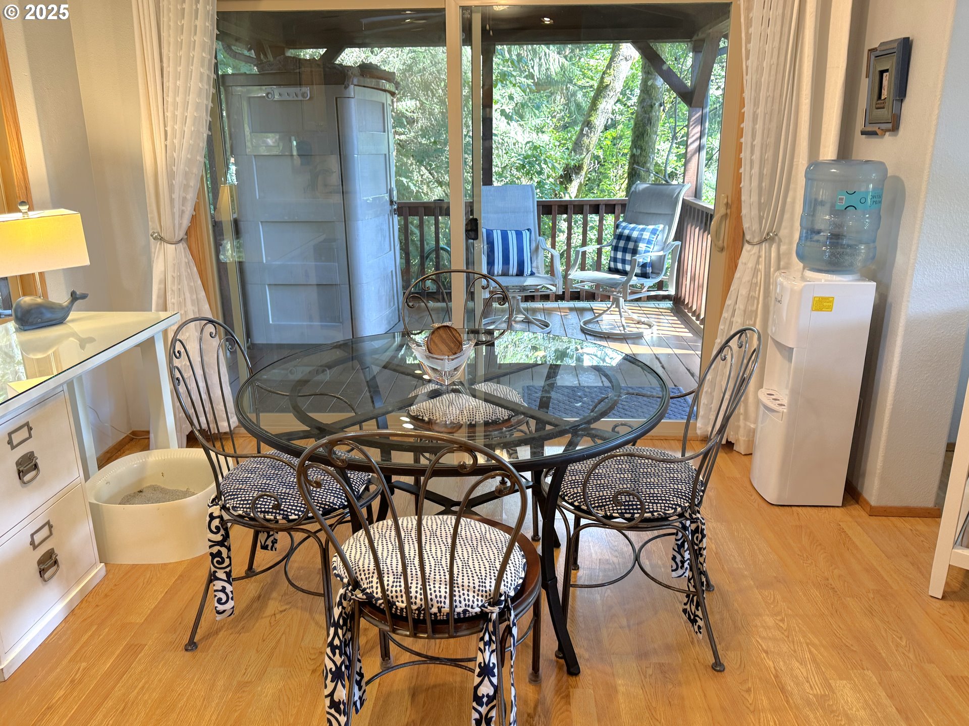 19921 Whaleshead Road, Unit EL1 Brookings, OR 97415 - Photo 10 of 29 a view of a dining room with furniture and wooden floor