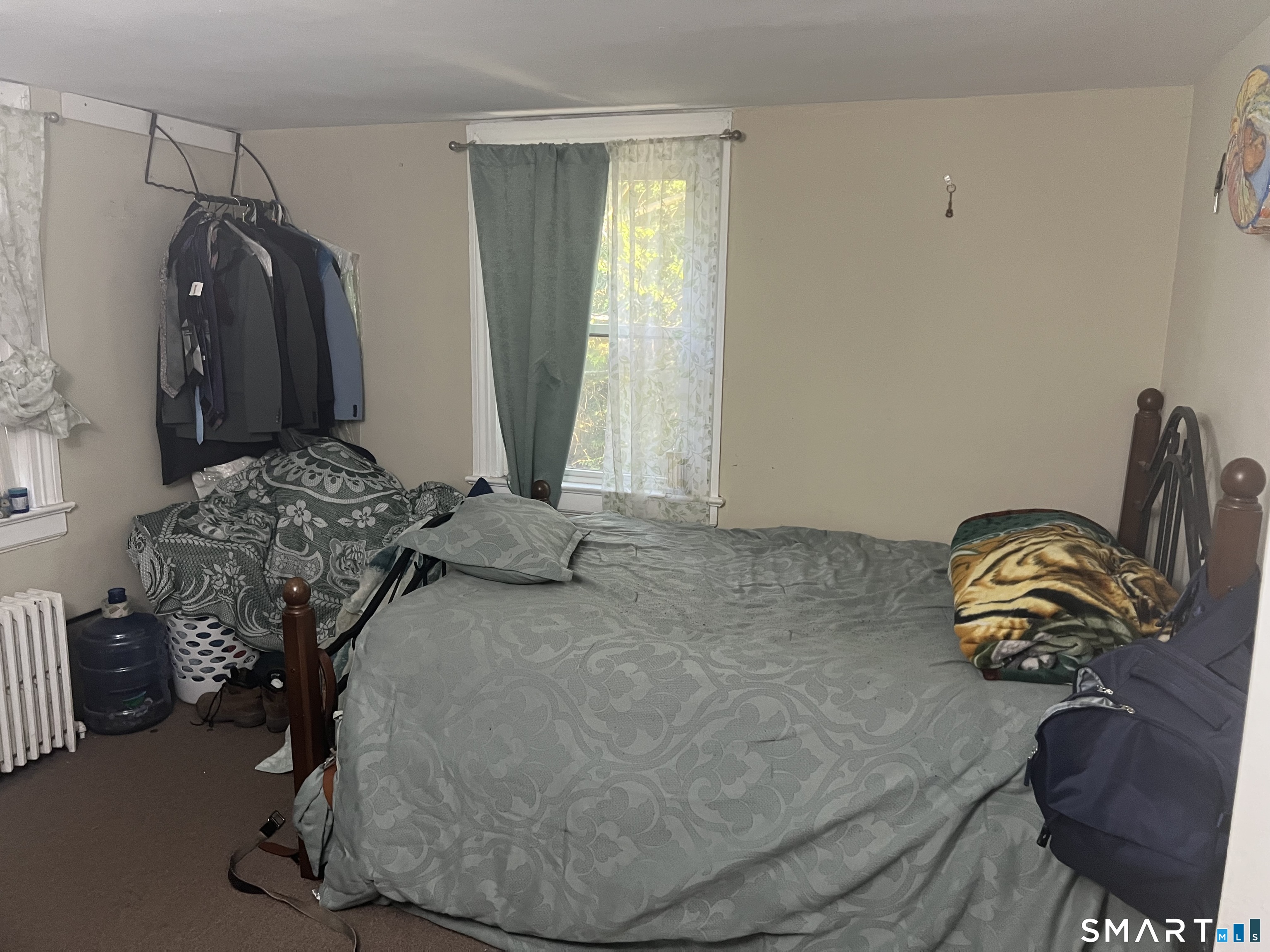 275 Long Ridge Road Stamford, CT 06905 - Photo 34 of 40 a bedroom with a bed and wooden floor