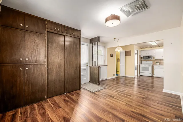 a view of a livingroom with wooden floor