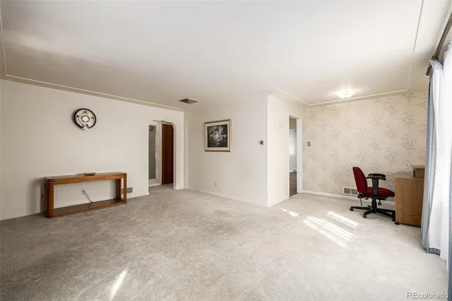 a view of a livingroom with a workspace