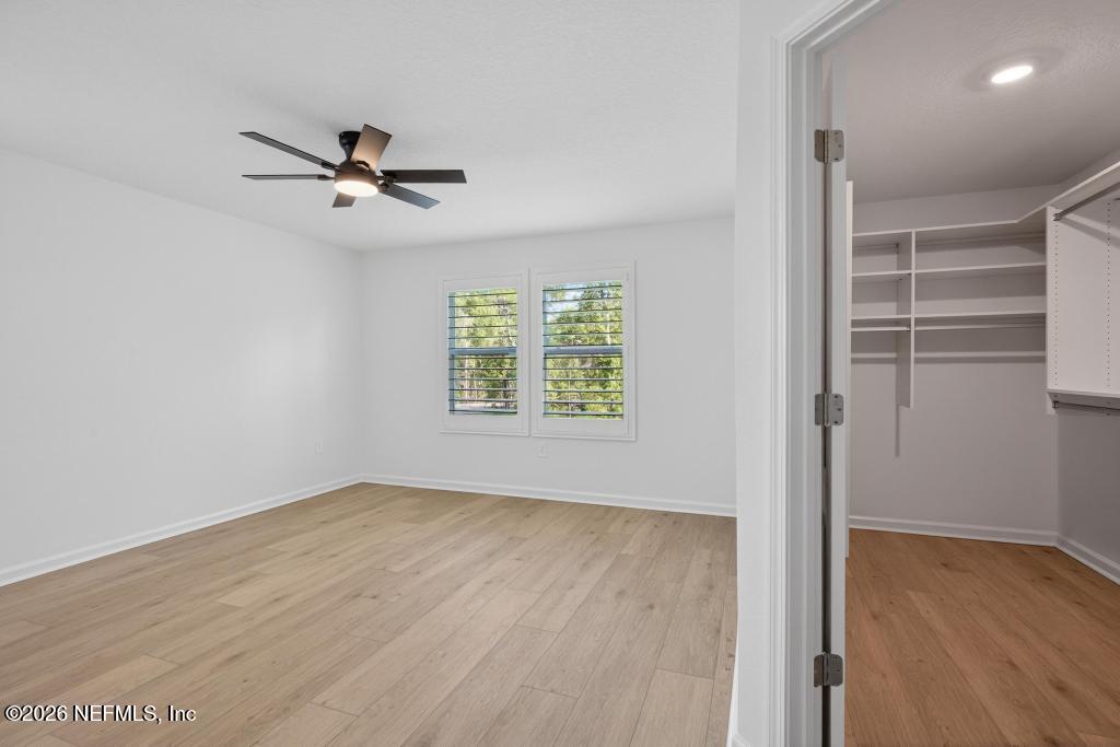45 Seaport Breeze Road St. Augustine, FL 32095 - Photo 59 of 88 a view of empty room with wooden floor and fan