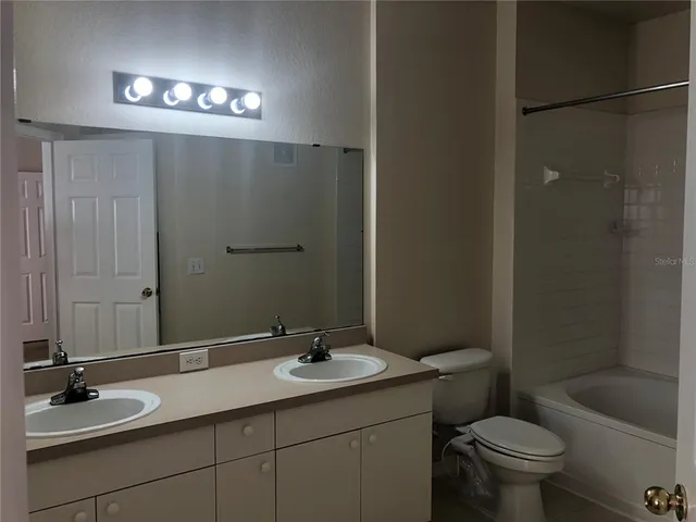 a bathroom with a shower and a toilet