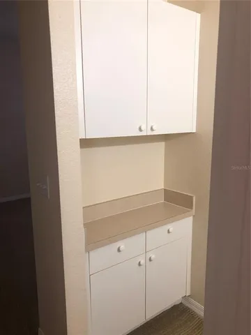 a bathroom with a sink and vanity