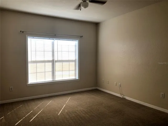 a kitchen with a sink a stove and cabinets