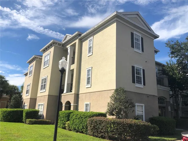 a swimming pool with outdoor seating and yard
