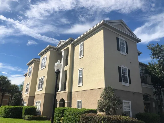 a view of a patio with a table and chairs