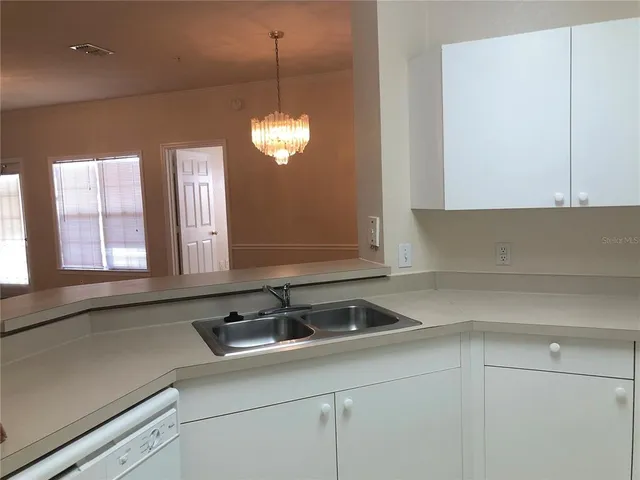 a kitchen with a sink and cabinets
