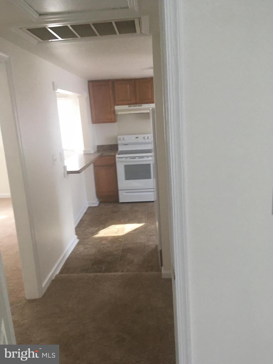 715 Rigby Avenue Cambridge, MD 21613 - Photo 11 of 21 Hall into Kitchen
