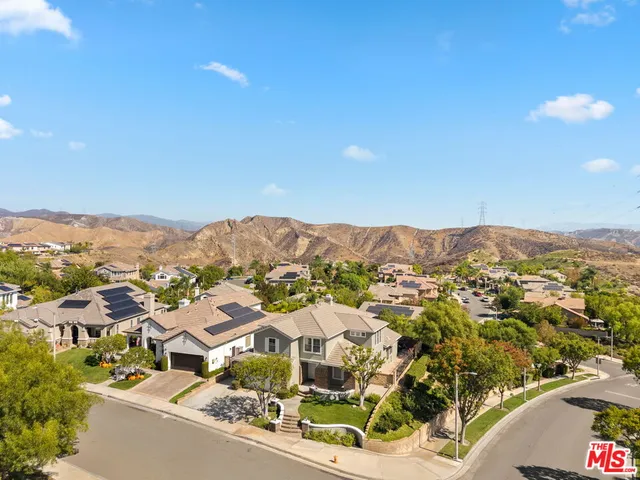 a view of a city with mountains in the background