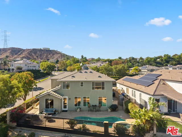 a aerial view of a house with a yard