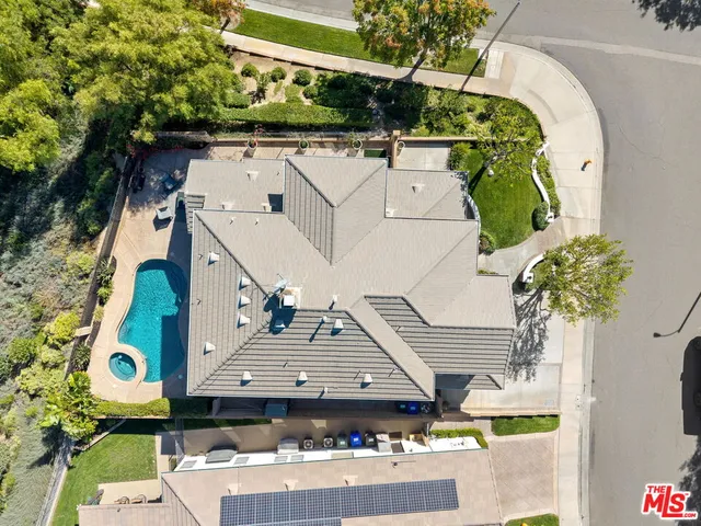 an aerial view of a house with a swimming pool