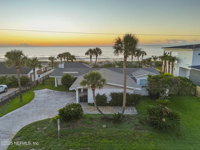 a view of a garden with a building in the background