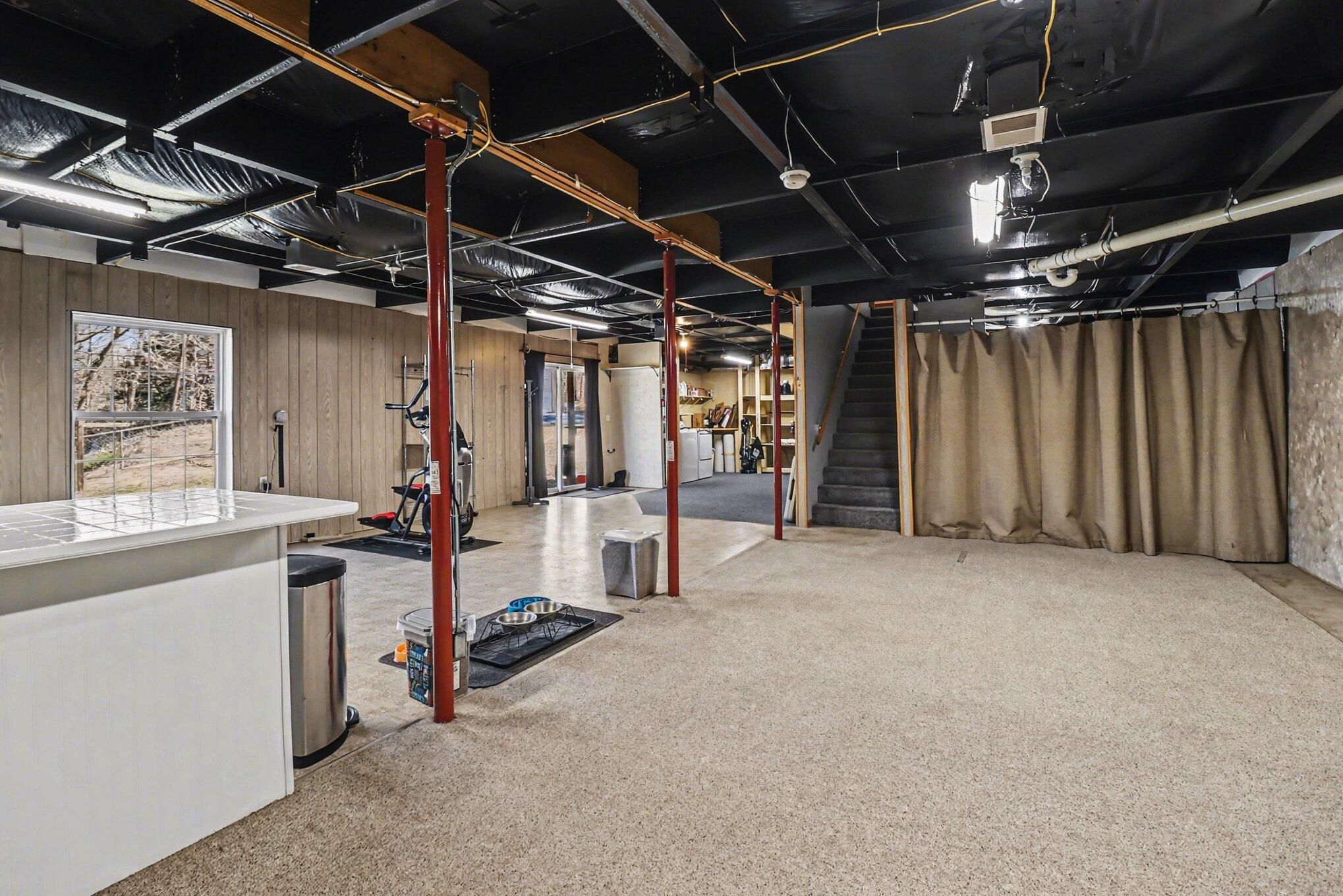 1130 Brookridge Road Ludington, MI 49431 - Photo 21 of 30 Recreation Room, laundry beyond