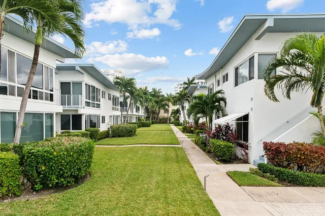 a view of backyard with a garden and plants