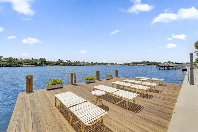 a view of a swimming pool with outdoor seating