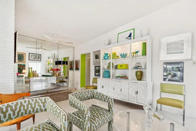 a living room with fireplace furniture and a flat screen tv