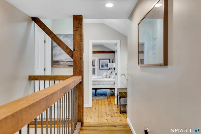 a view of an entryway with wooden floor and windows