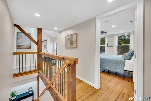 a spacious bathroom with a tub shower and a sink