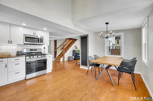 a dining room with furniture and window