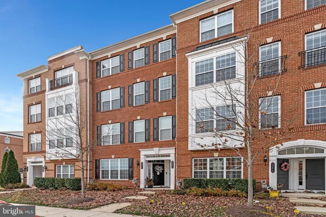 a front view of a building with lot of windows
