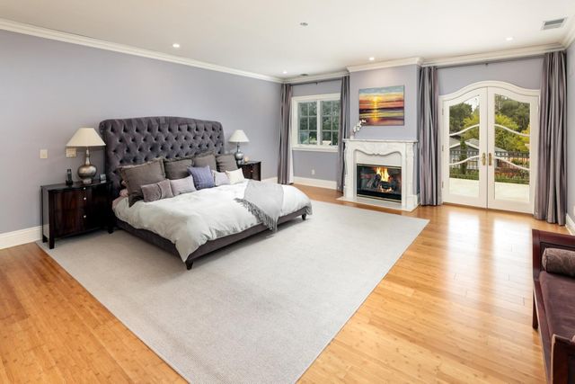 a bedroom with a bed and a fireplace