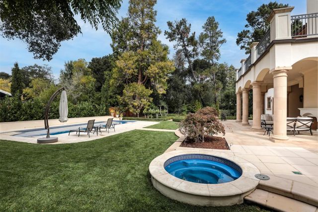 a view of a swimming pool with back yard