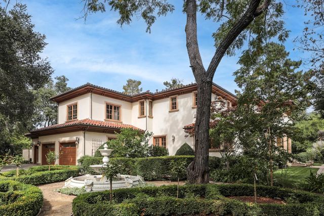 a white house sitting in middle of forest