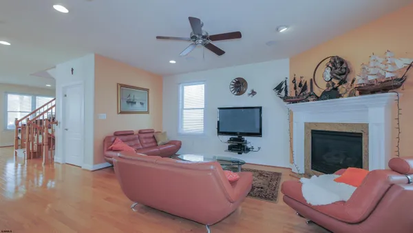a living room with furniture and a book shelf