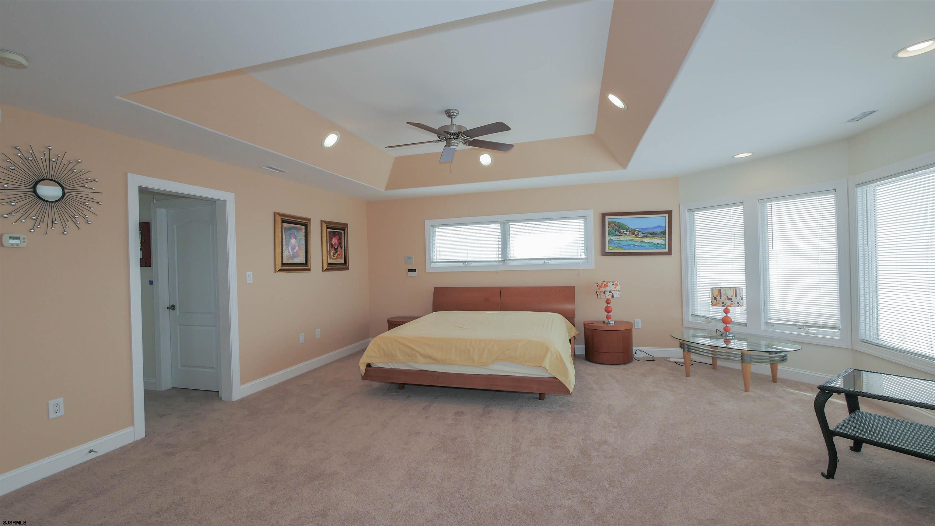 229 8th Street North Brigantine, NJ 08203 - Photo 21 of 42 a bed room with a bed and a chair