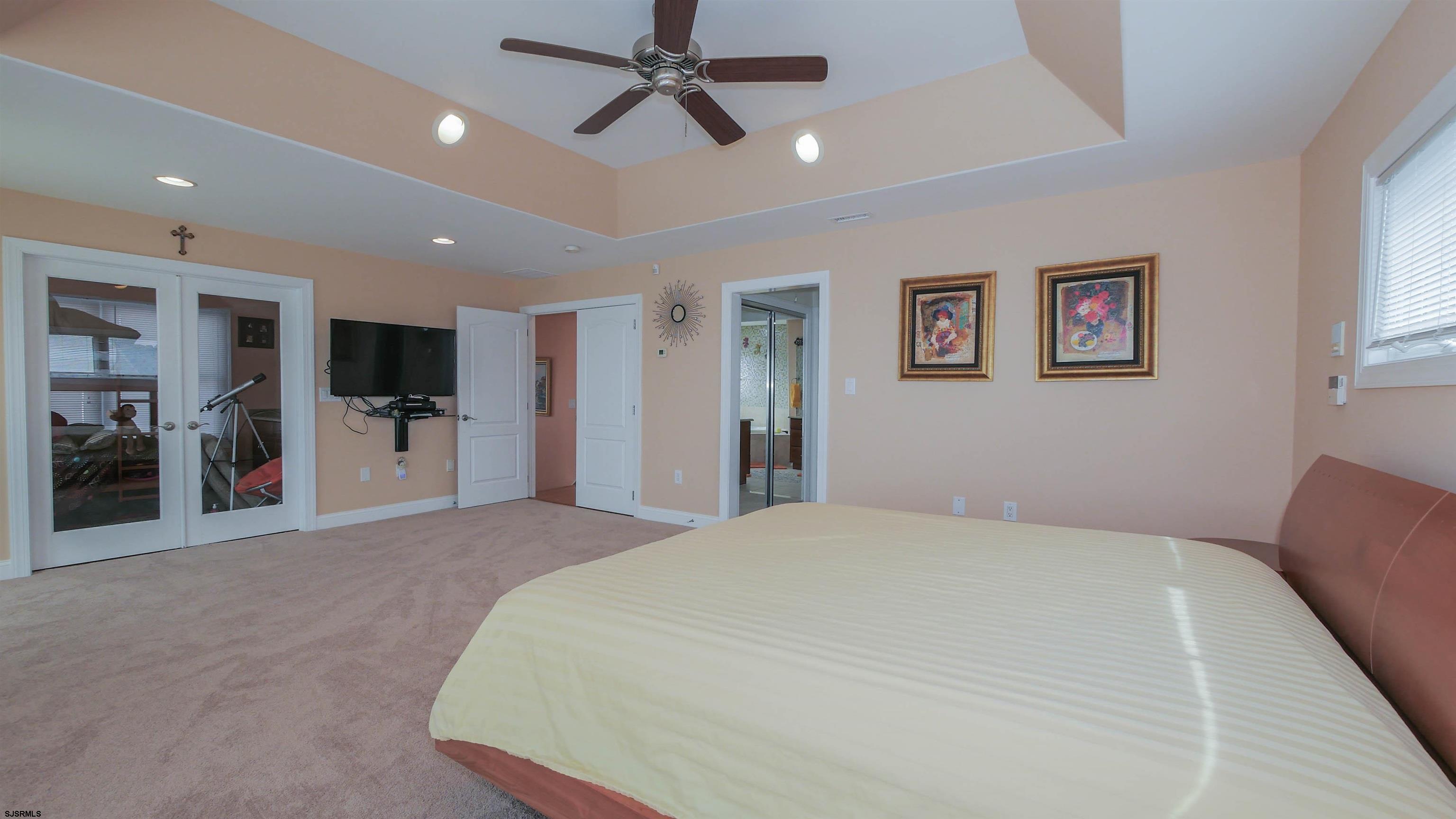 229 8th Street North Brigantine, NJ 08203 - Photo 22 of 42 a large white bed in a white room