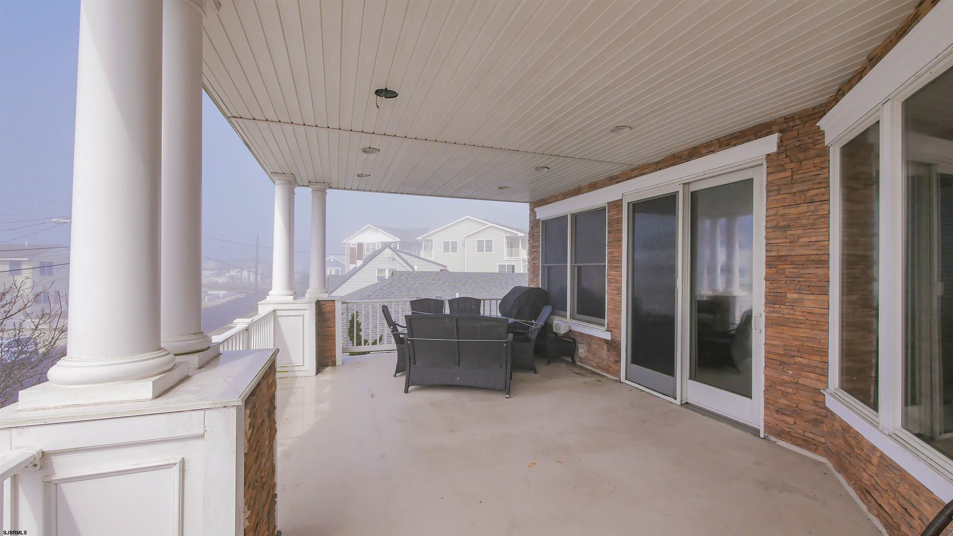 229 8th Street North Brigantine, NJ 08203 - Photo 32 of 42 a living room with furniture and a large window
