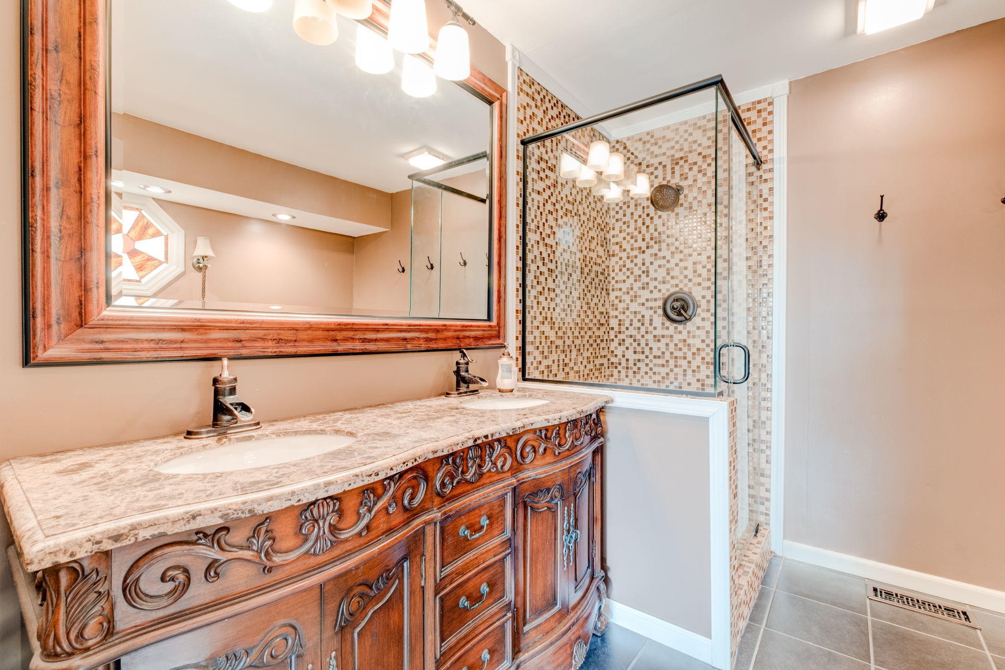 132 Pheasant Road Clinton, TN 37716 - Photo 34 of 40 a bathroom with a granite countertop sink a mirror and a shower