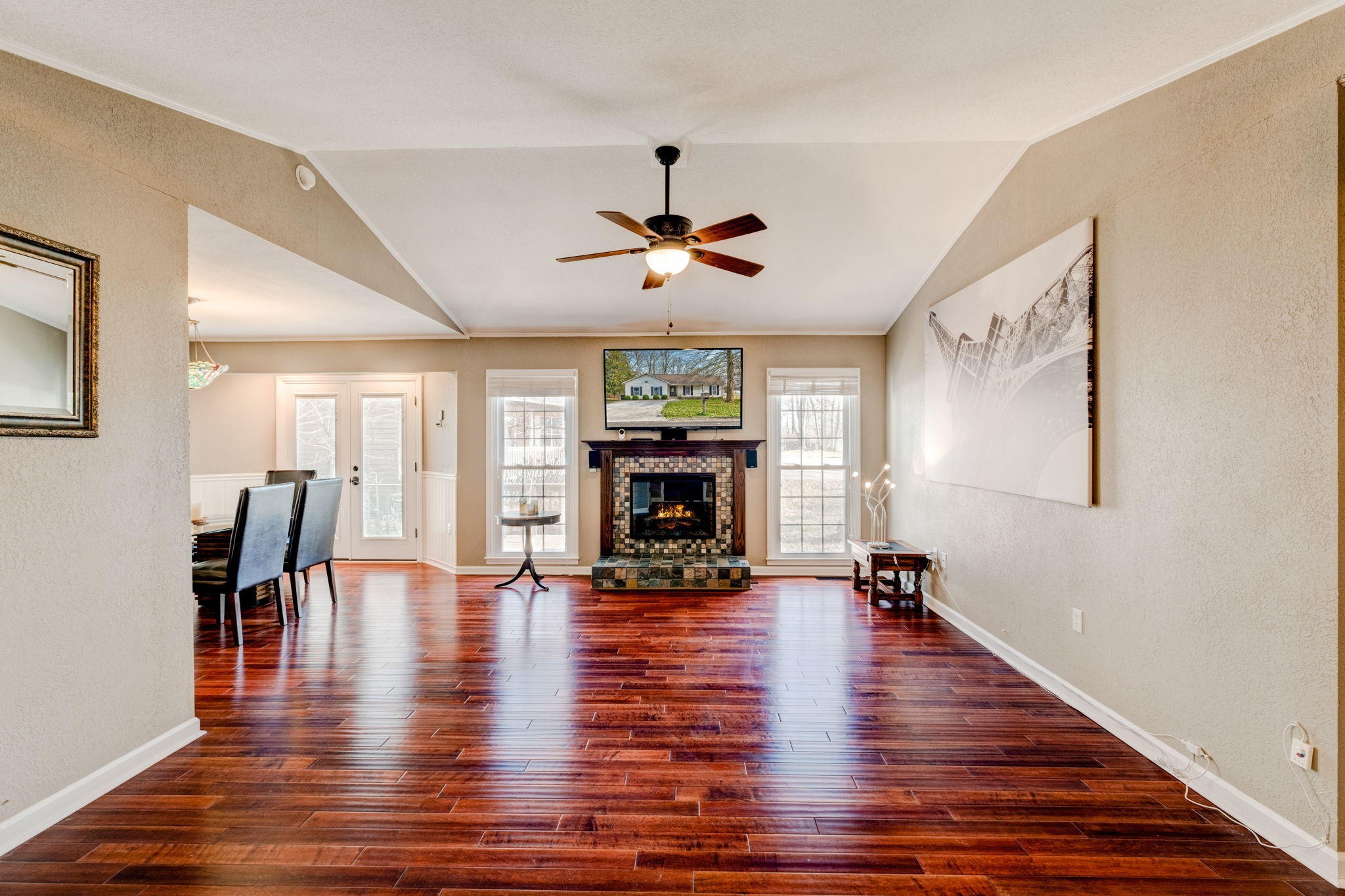 132 Pheasant Road Clinton, TN 37716 - Photo 4 of 40 a living room with fireplace furniture and a wooden floor