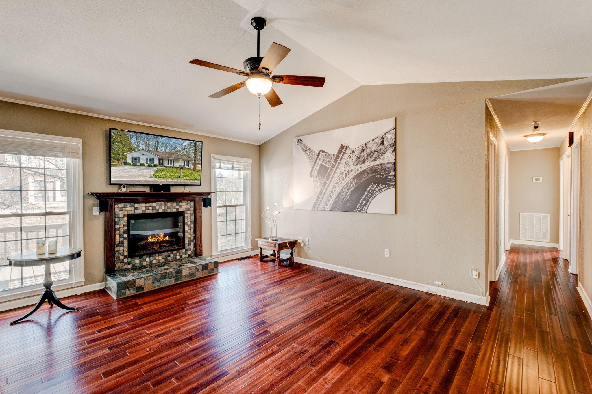 132 Pheasant Road Clinton, TN 37716 - Photo 5 of 40 a view of wooden floor fire place refrigerator and window in a room