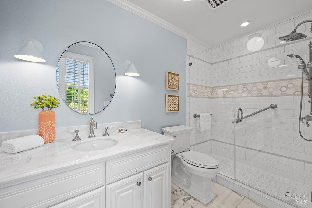 82 McNear Drive San Rafael, CA 94901 - Photo 29 of 54 a bathroom with a toilet sink and mirror