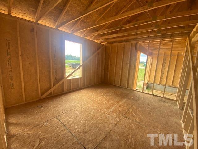 209 Mamie Road Benson, NC 27504 - Photo 8 of 28 a view of an empty room with windows