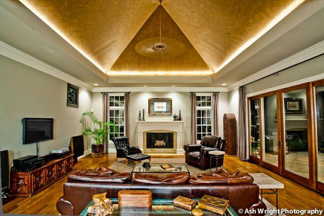8317 Guthrie Road Cross Plains, TN 37049 - Photo 8 of 20 Den with cast limestone fireplace, wood flooring, and vaulted hand painted metallic trey ceiling