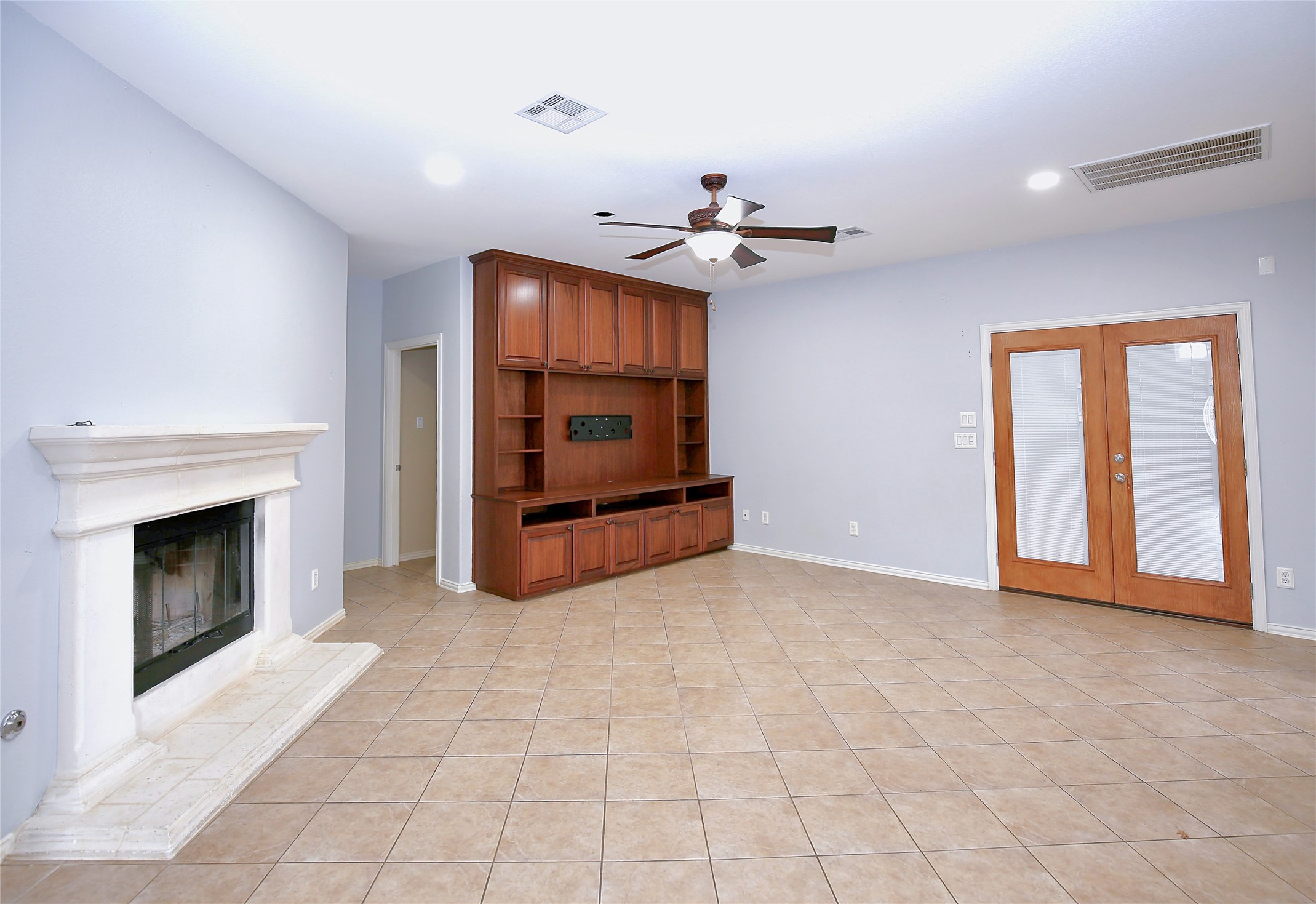 2002 Singing Hills Leander, TX 78641 - Photo 8 of 31 a view of an empty room with furniture and a fireplace
