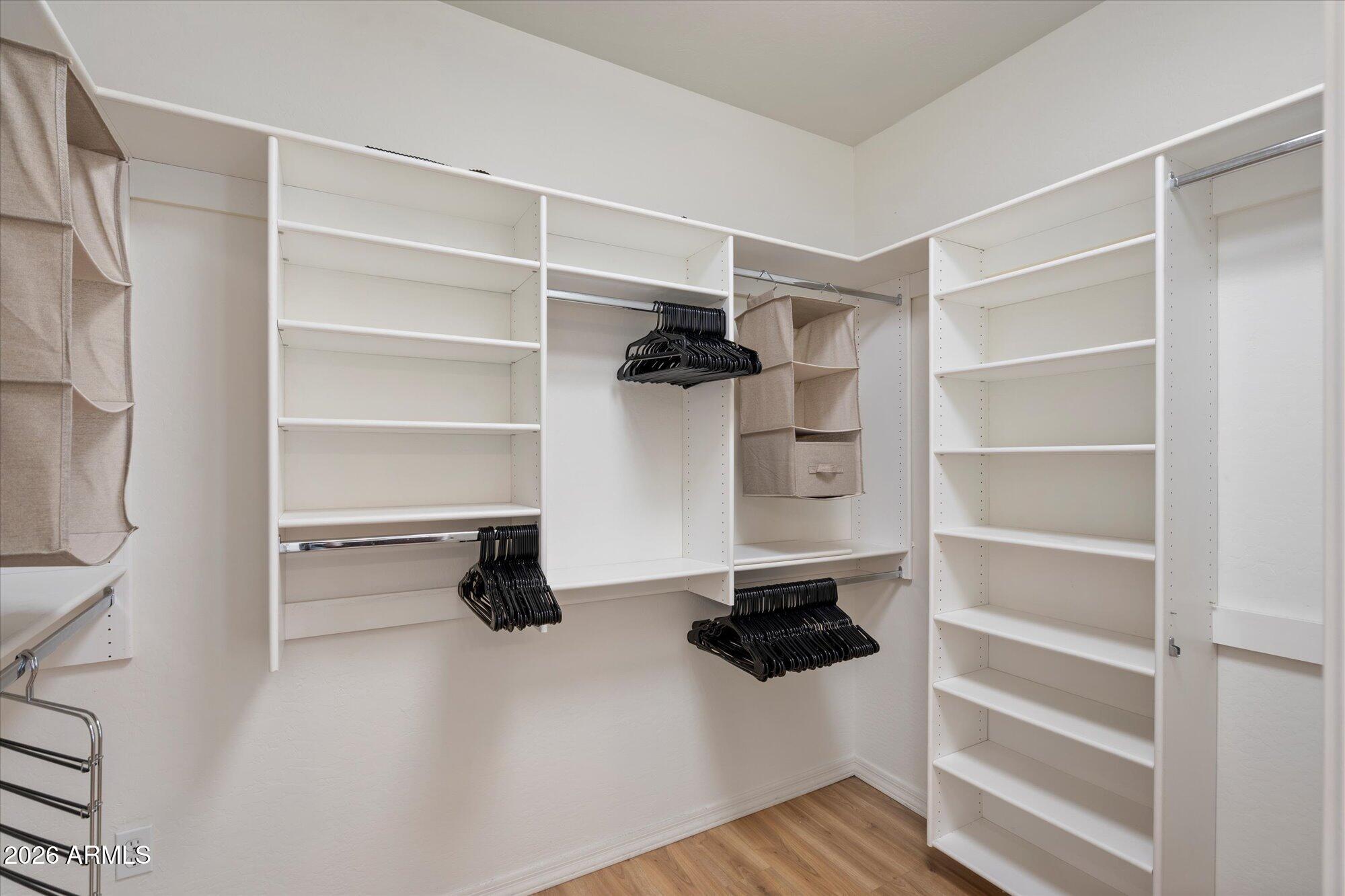 3935 East Rough Rider Road, Unit 1034 Phoenix, AZ 85050 - Photo 12 of 25 Walk-in closet